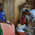 Mother and newborn receiving follow-up care in Uganda