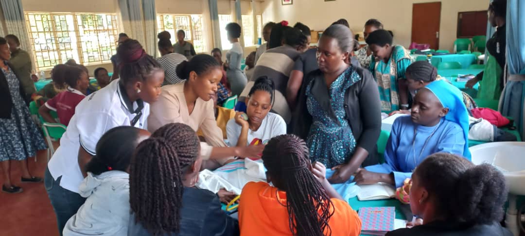 Mentor midwives training nurses and midwives from lower-level health facilities